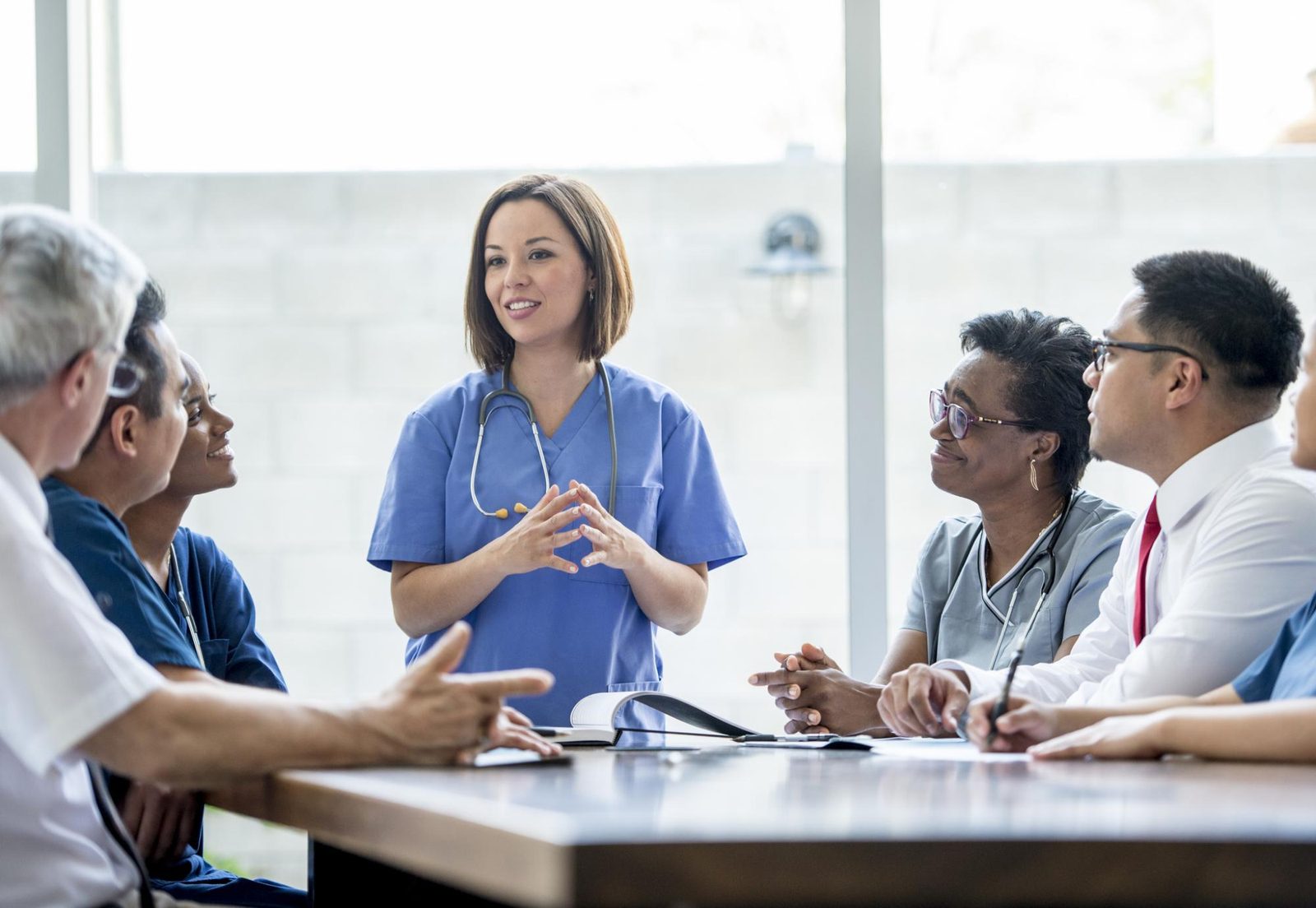 A maternity leadership team in discussion around a table